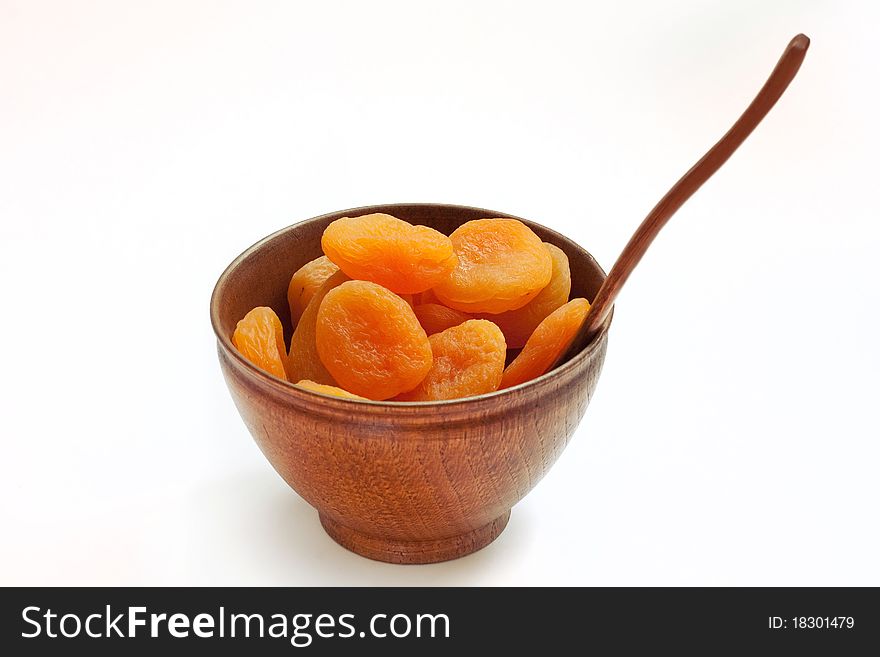 Dry apricot on the wooden dish