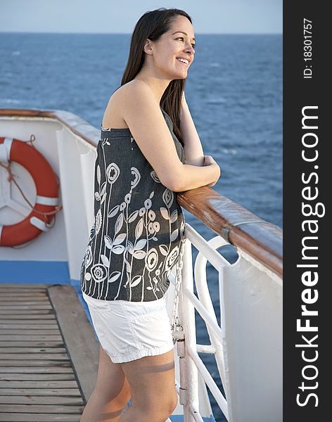 Woman on cruise ship looking out to sea. Woman on cruise ship looking out to sea