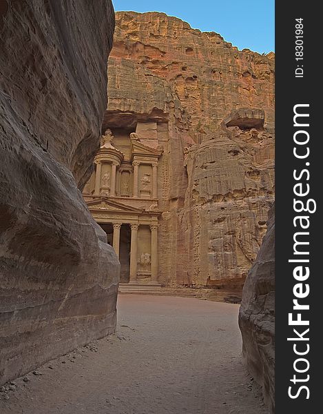 Magical sunrise at the Treasury (El Khazneh) from the canyon (Siq). Petra, Jordan. Magical sunrise at the Treasury (El Khazneh) from the canyon (Siq). Petra, Jordan