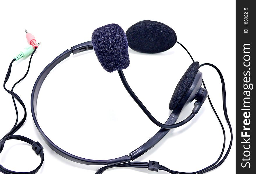 Black headphones with microphone on white
