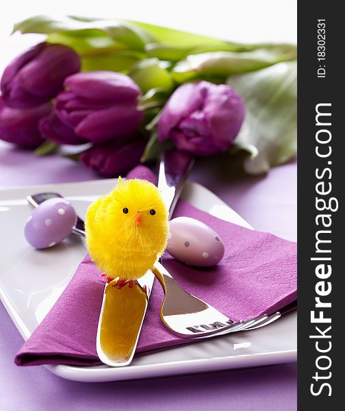 Easter table setting with biddy and cutlery