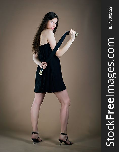 Young woman posing with a girdle posing in studio. Young woman posing with a girdle posing in studio