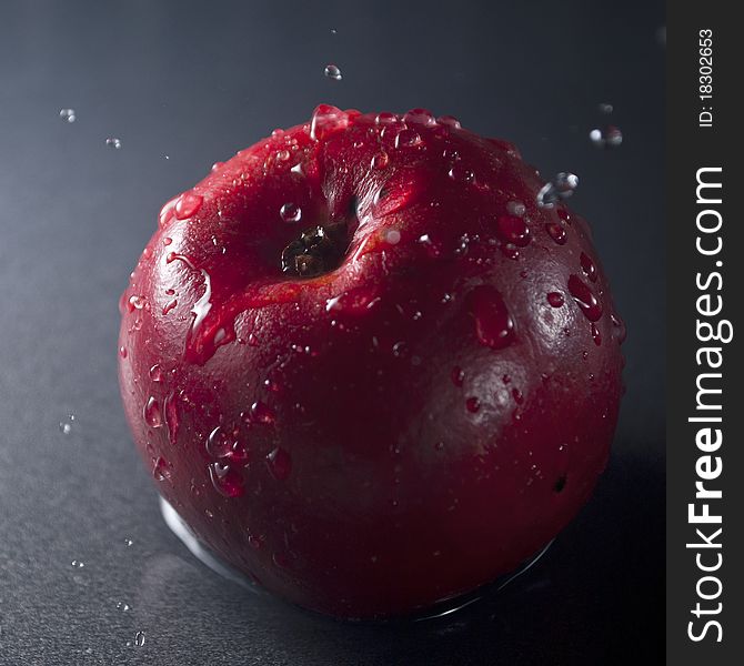 Playing with apple and water splashes