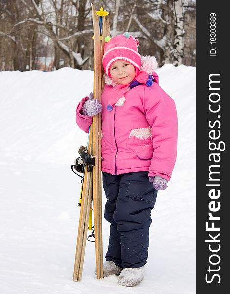 Girl with skis in hand.