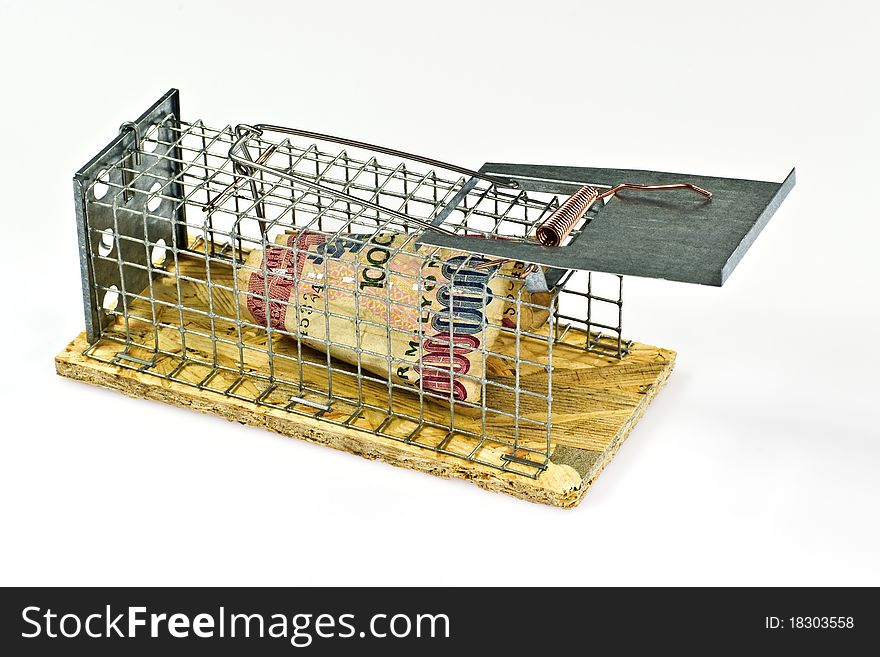 Mouse trap with banknote on white background