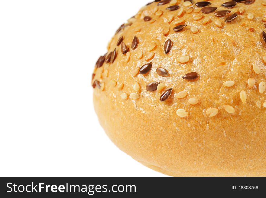 Bun, topped with sesame seeds. Isolated on white.