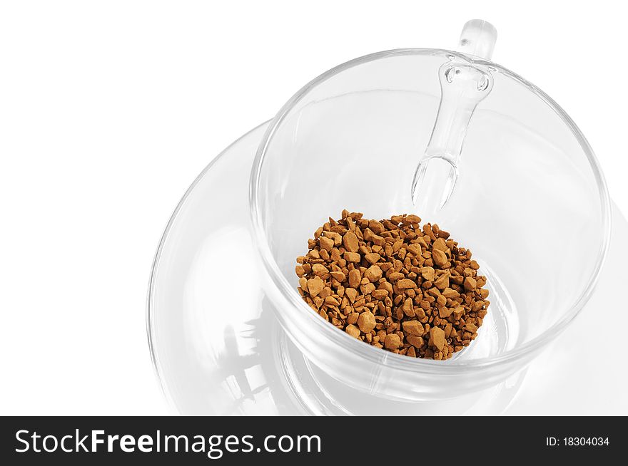 Transparent glass cup with instant coffee. Isolated on white. Transparent glass cup with instant coffee. Isolated on white.