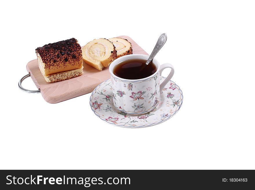 Cup of tea with a biscuit on a white background. Cup of tea with a biscuit on a white background