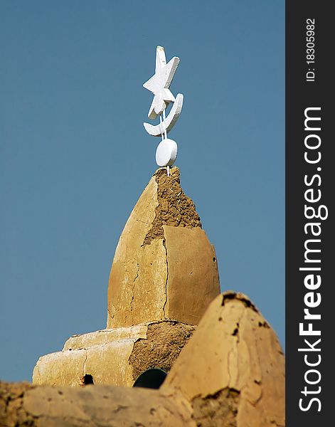 White spire on mud mosque minaret in West Africa. White spire on mud mosque minaret in West Africa