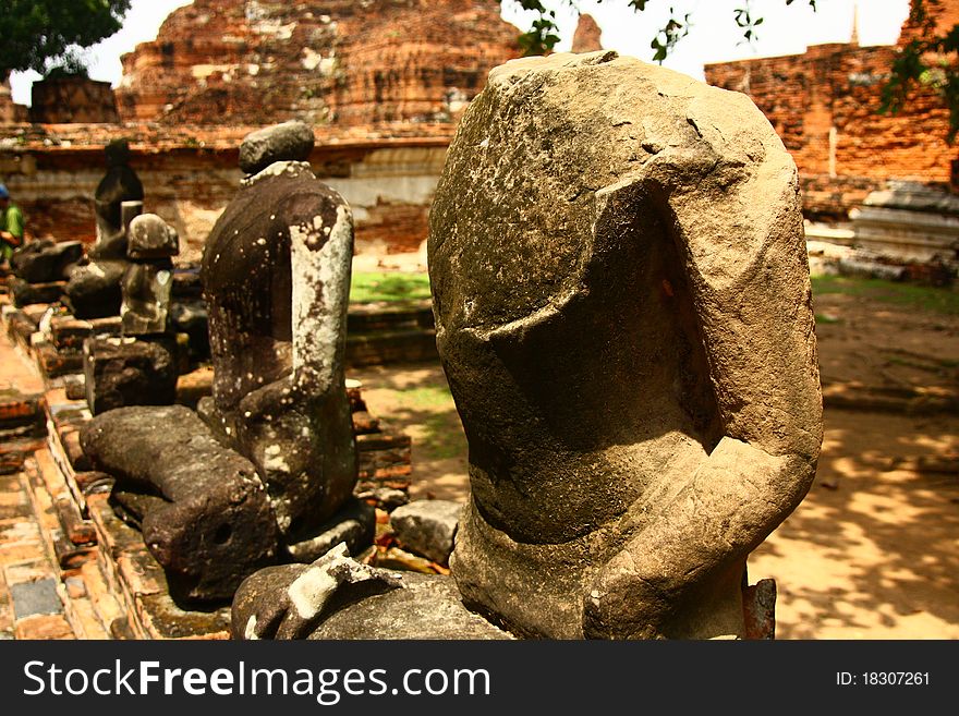 This is a broken sculpture of lord Buddha in the ruin temple in the middle of Thailand. This is a broken sculpture of lord Buddha in the ruin temple in the middle of Thailand