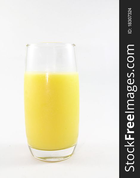 A glass of corn juice on a white background