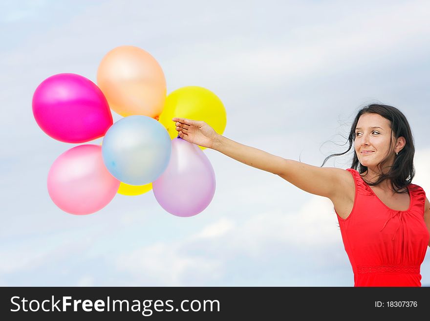 Young Attractive Woman With Colorful Balloons