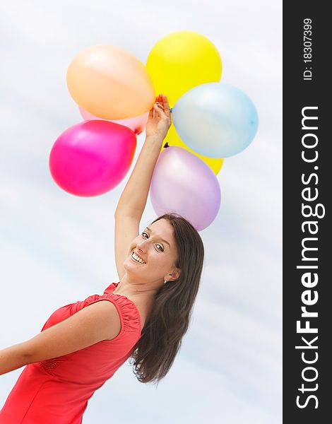 Young attractive woman with colorful balloons
