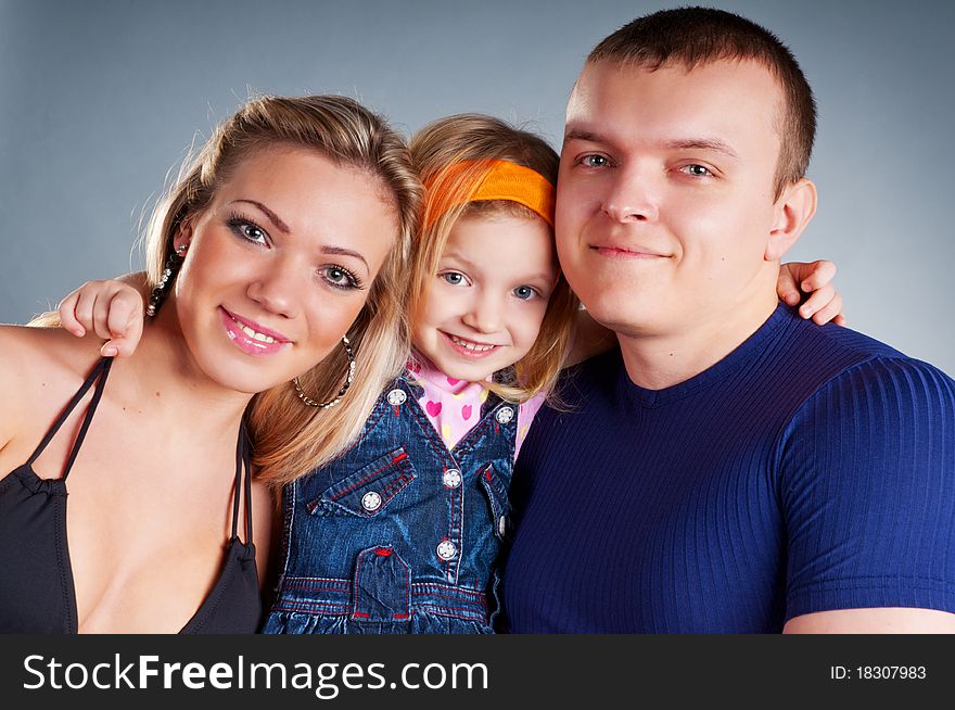 Portrait of a young happy family with the kid. Portrait of a young happy family with the kid