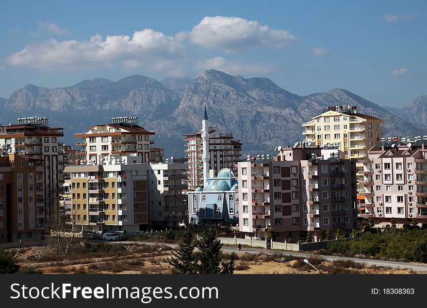 A view of buildings with the mountains in Antalya, Turkey. A view of buildings with the mountains in Antalya, Turkey.