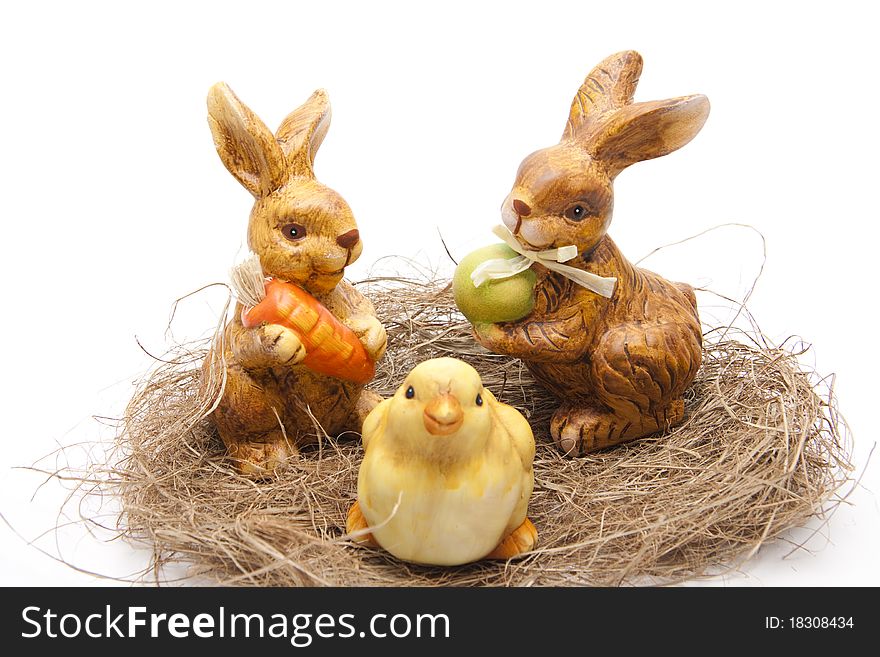 Easter bunnies with chickens in the hay