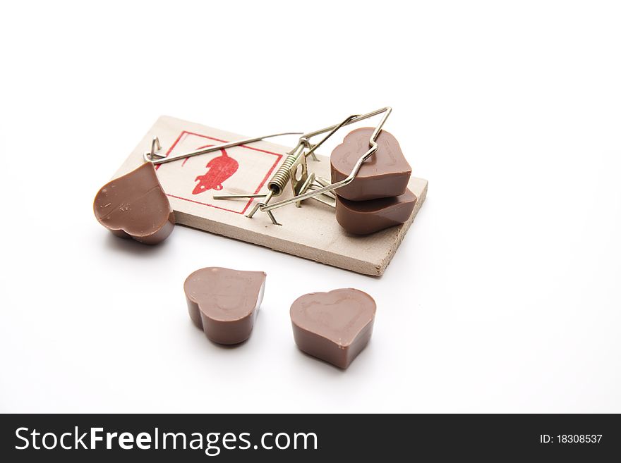 Chocolates with heart in the mousetrap. Chocolates with heart in the mousetrap