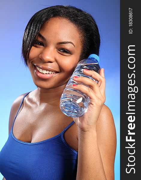 Beautiful healthy black girl with bottled water