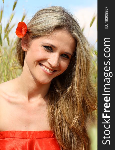 Outdoor shot of beautiful woman in red dress. Outdoor shot of beautiful woman in red dress