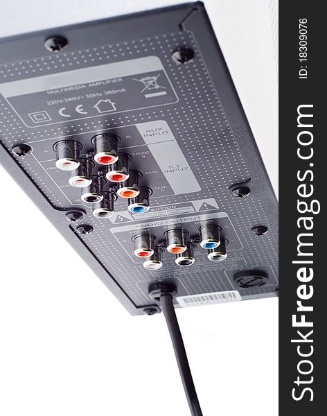 The back side of an audio amplifier, white background, isolated. The back side of an audio amplifier, white background, isolated