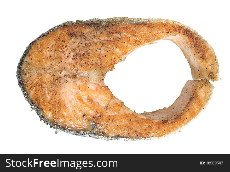 Fried cut salmon on white background