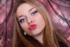 Kiss Of A Beautiful Young Woman Royalty Free Stock Photography