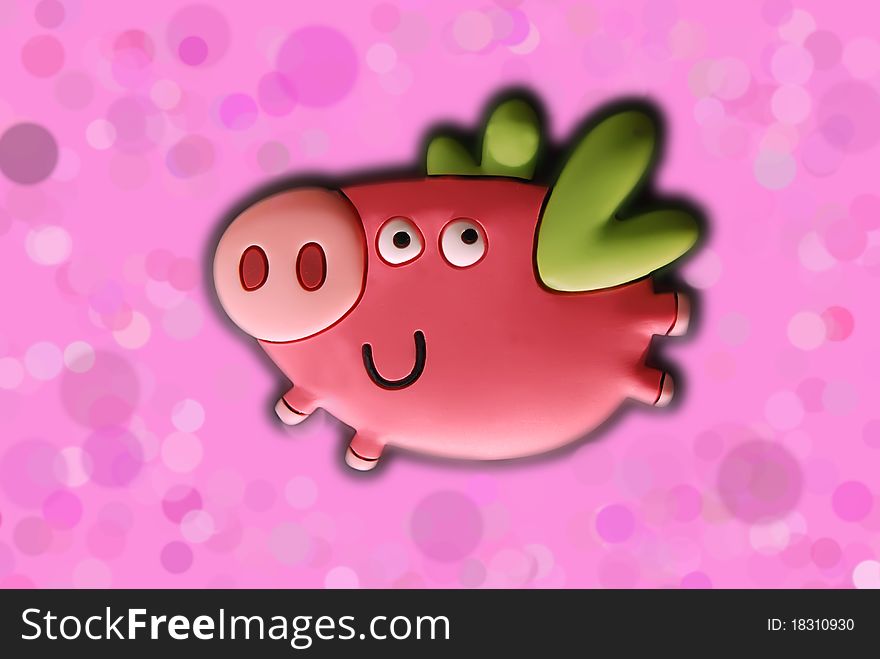 Funny flying toy pig on pink background