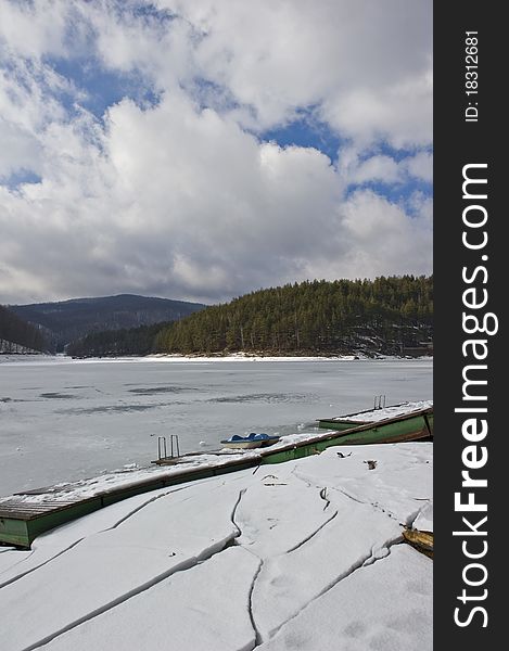 Landscape with dam frozen in winter. Valiug dam, Romania. Landscape with dam frozen in winter. Valiug dam, Romania
