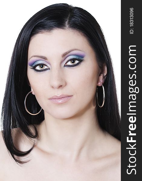 Attractive brunette woman with blue and purple makeup