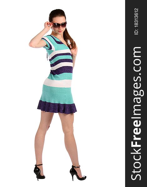 Girl in stripy blue dress turned around with sunglasses. Isolated on white. Girl in stripy blue dress turned around with sunglasses. Isolated on white.