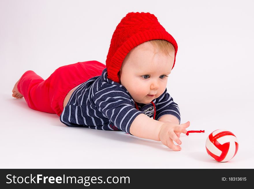 Little child baby crawling for the  ball