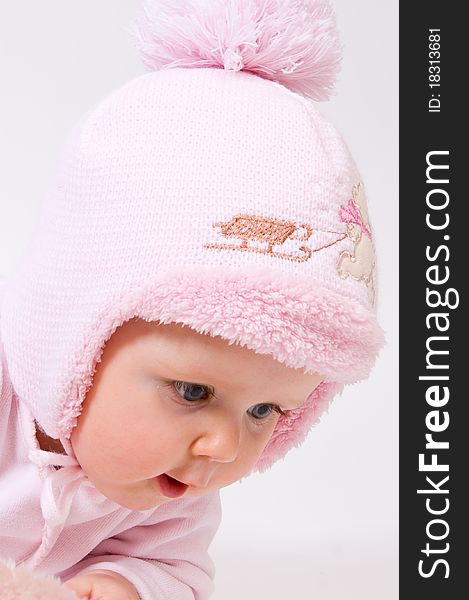 Little child baby in a pink hat