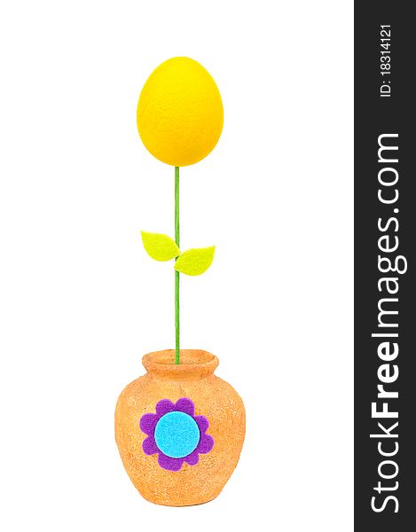 Colourful Easter egg in a yellow vase. Isolated on the white