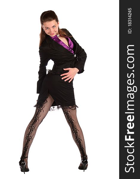 Girl in black suit posing twisted back.