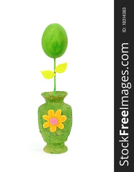 Colourful Easter egg in a green vase. Isolated on the white