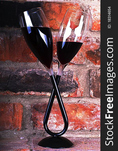 Red wine on brick wall background. Red wine on brick wall background