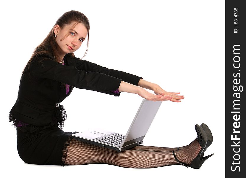 Girl In Black Suit Sits On Floor With Laptop.