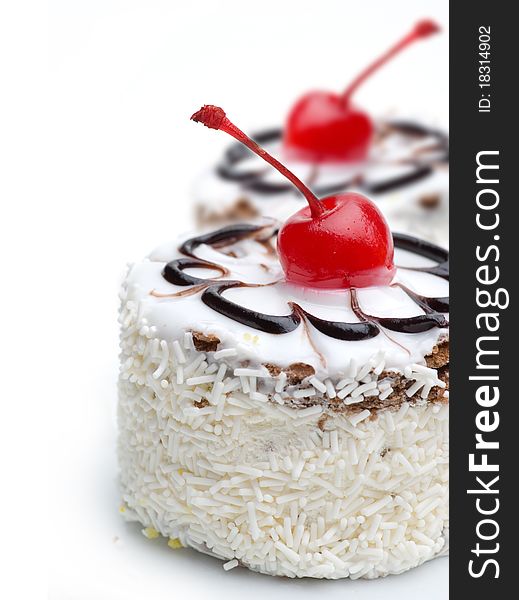 Cake with cherry topping isolated