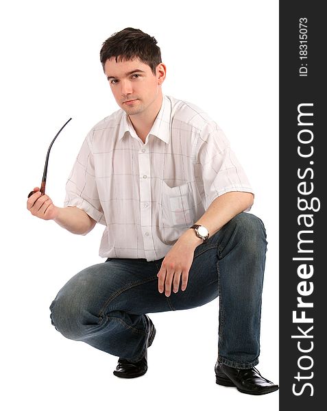 Young man sits demonstrating tobacco-pipe. Isolated on white.