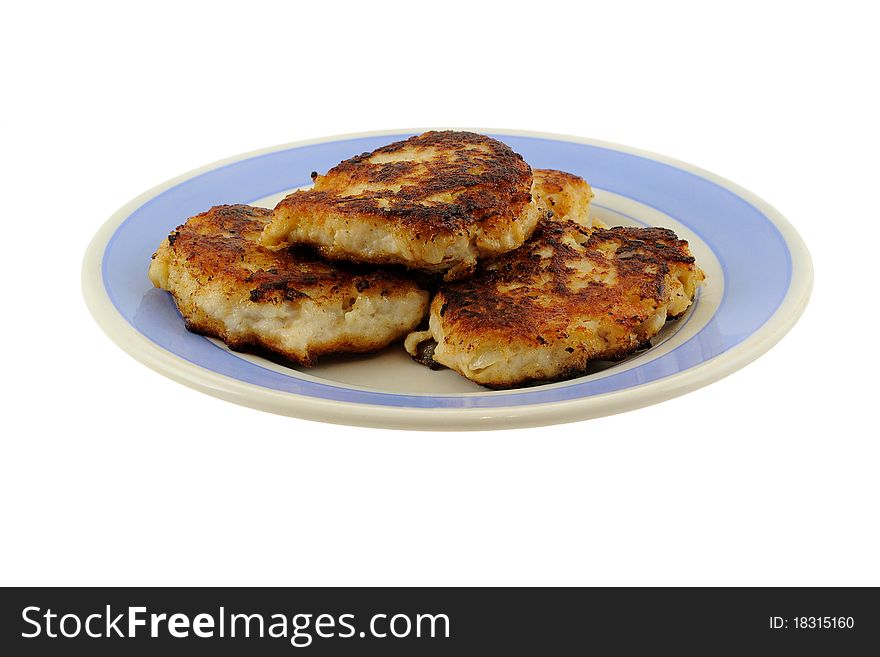 Fried meat on a blue and white plate isolated