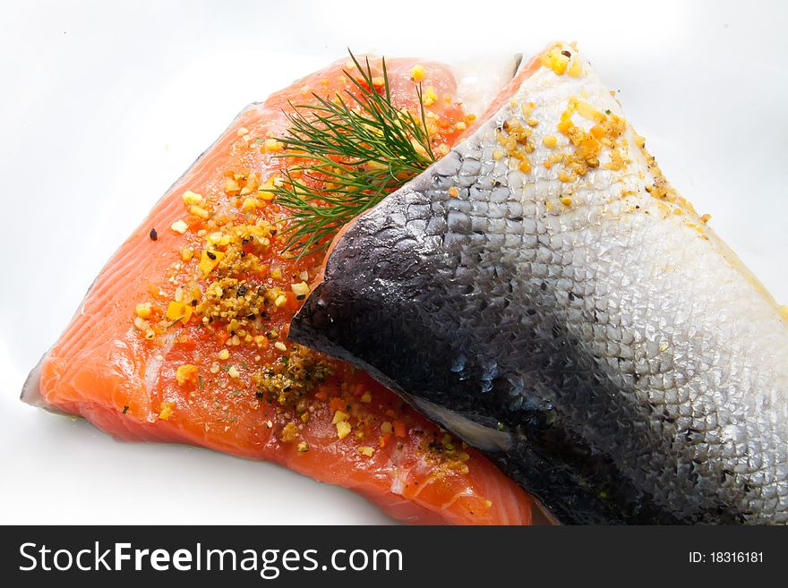 Raw isolated salmon with herbs