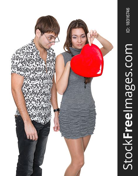 Funny nerd guy gives a valentine glamorous girl isolated on white