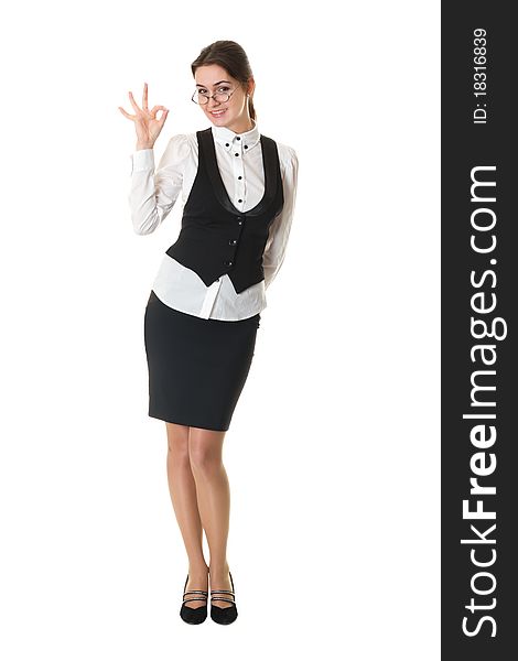 Young business woman in glasses shows okay sign