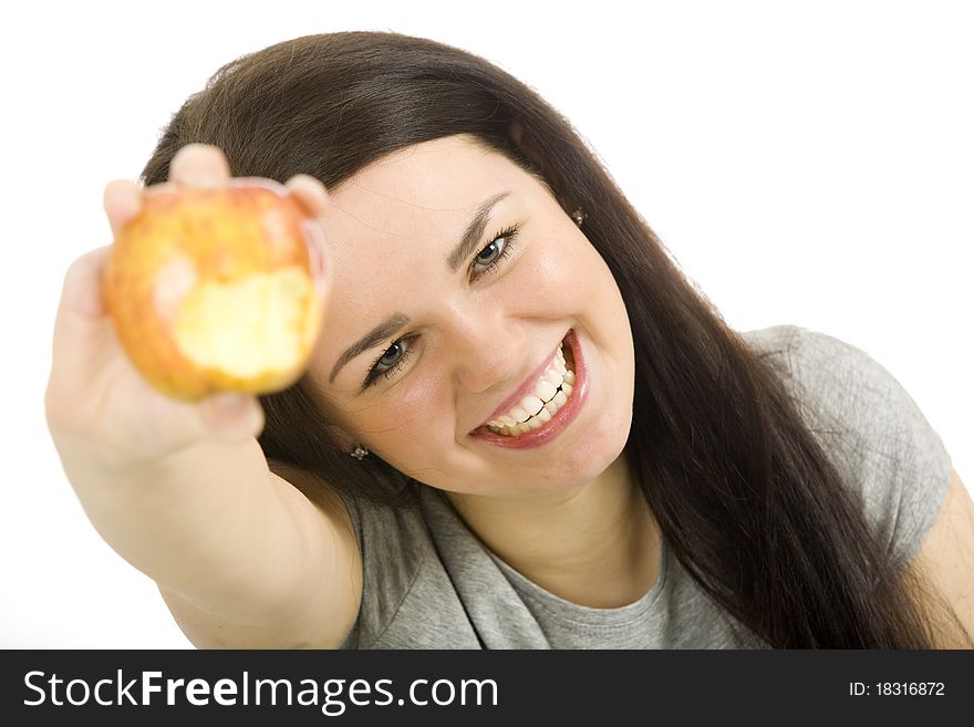 Nice woman holding a red apple in her hand. Nice woman holding a red apple in her hand