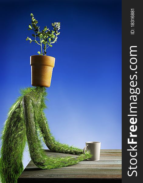 Herbal guy sitting at a table with a cup of water. Flower Pot instead of a head