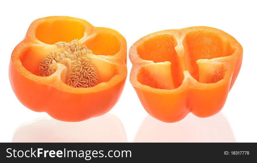 Half of orange sweet pepper with seeds. Half of orange sweet pepper with seeds