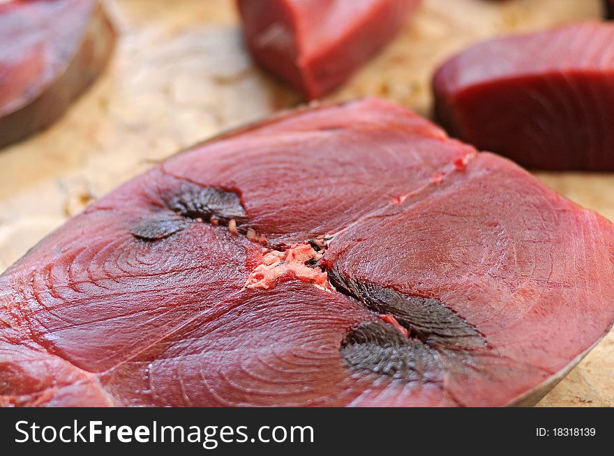 Some fresh tuna fish fillet from the fish market. Some fresh tuna fish fillet from the fish market.