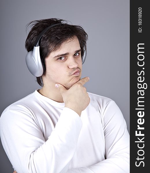 Young doubt men with headphone. Studio shot.