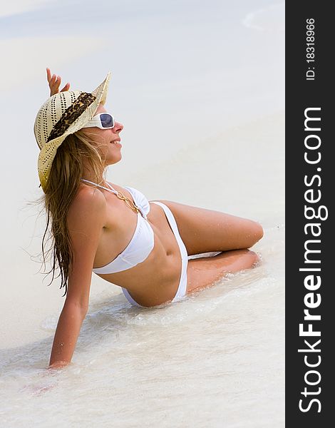 Lady In Bikini On A Tropical Beach