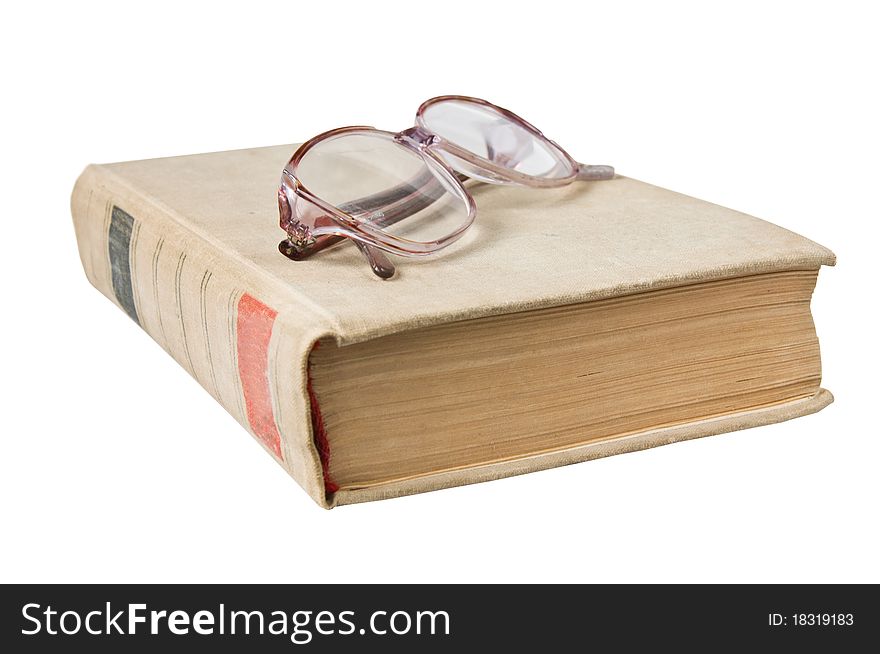 Glasses and book isolated on white background